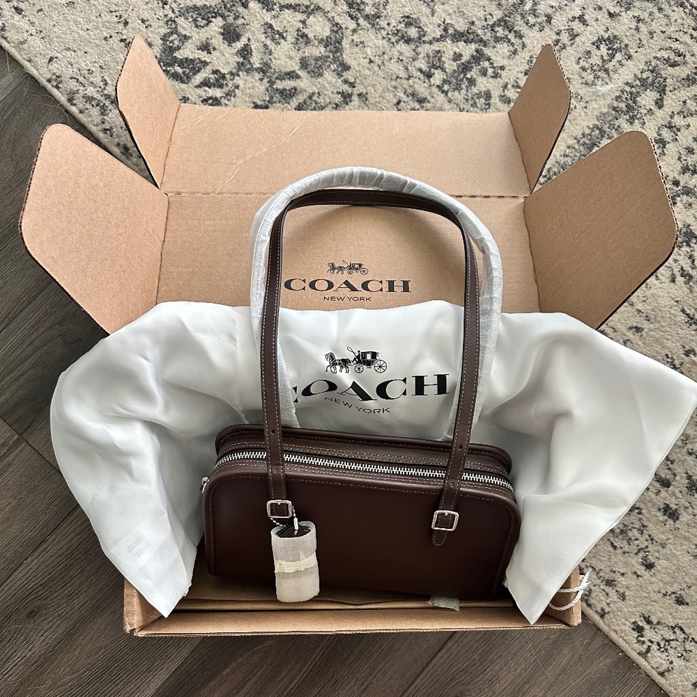 Coach Swing Zip